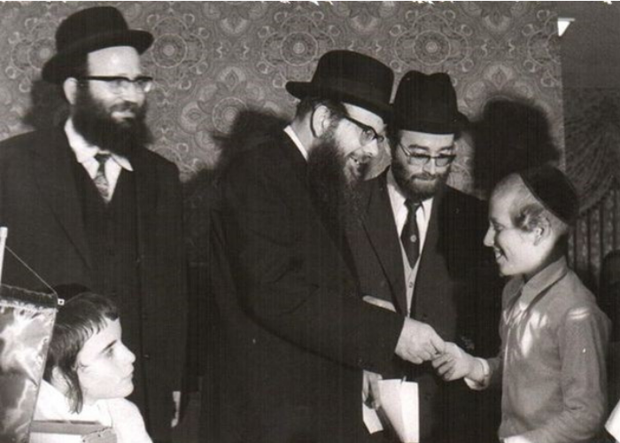 Rav Wolbe greets a young boy.