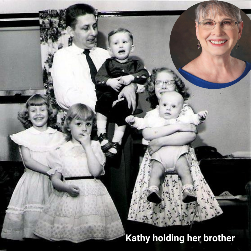 Kathy holding her brother.